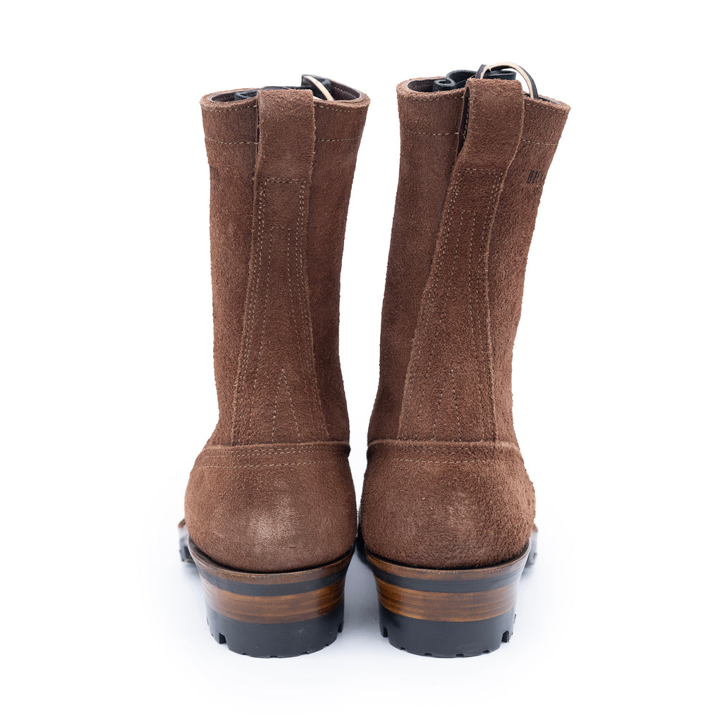 Pair of brown boots on a white background