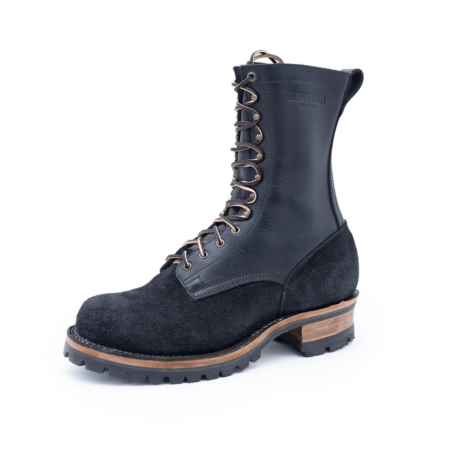 Black leather boot with brown sole on a white background