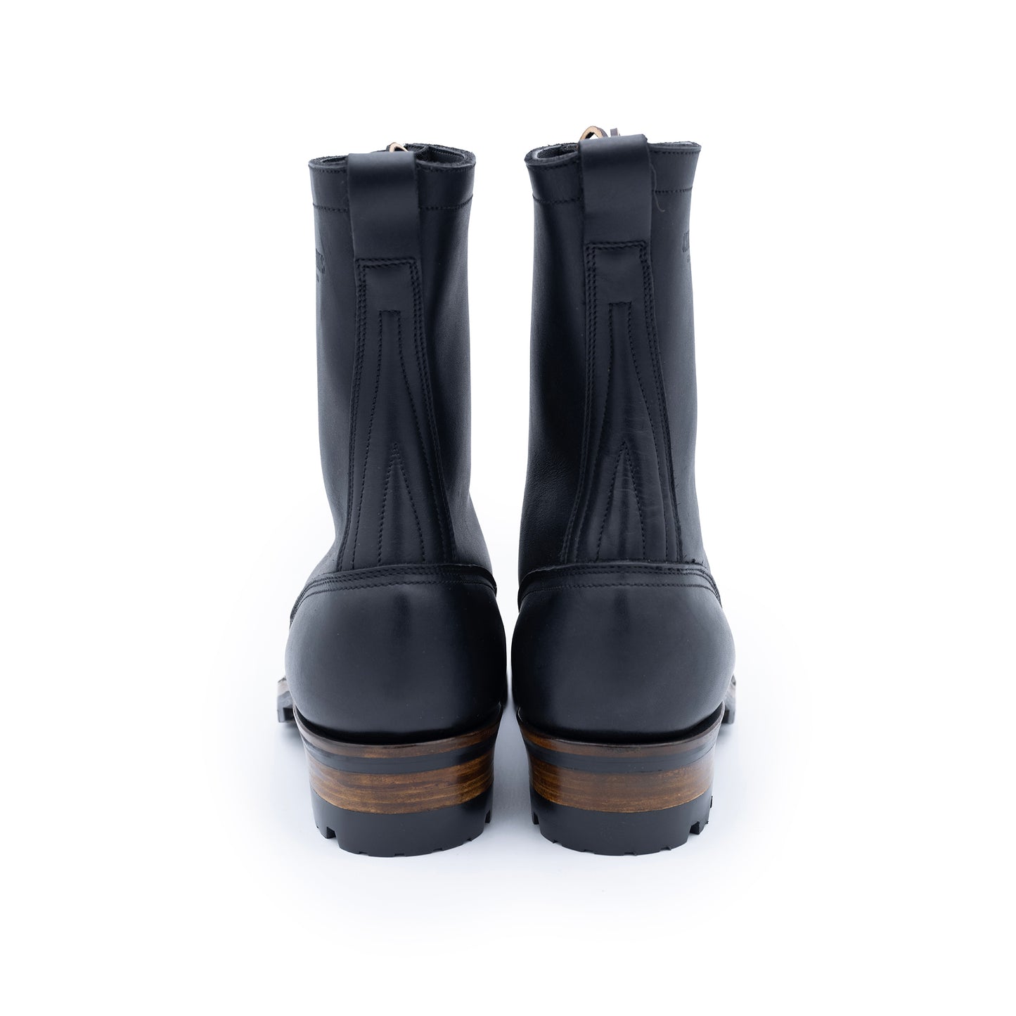 Pair of black rubber boots on a white background