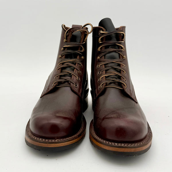 Pair of brown leather boots on a white background