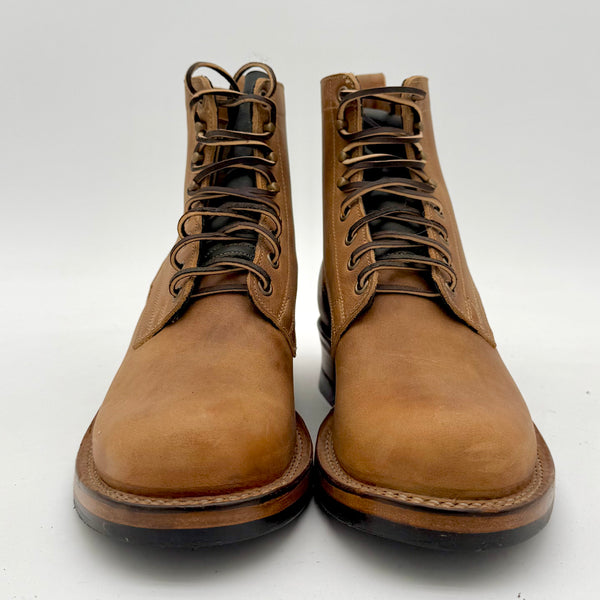 Pair of brown leather boots on a white background