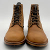Pair of brown leather boots on a white background