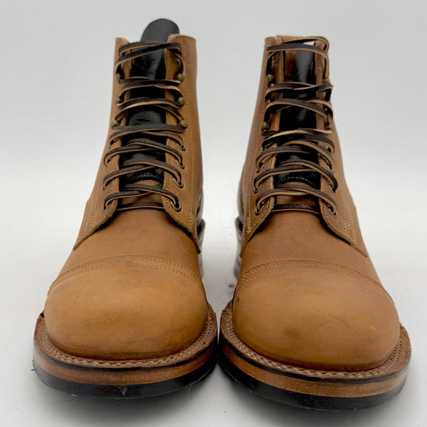 Pair of brown leather boots on a white background