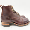 Brown leather boot with gold laces on a white background