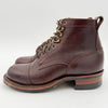 Brown leather boot with laces on a white background