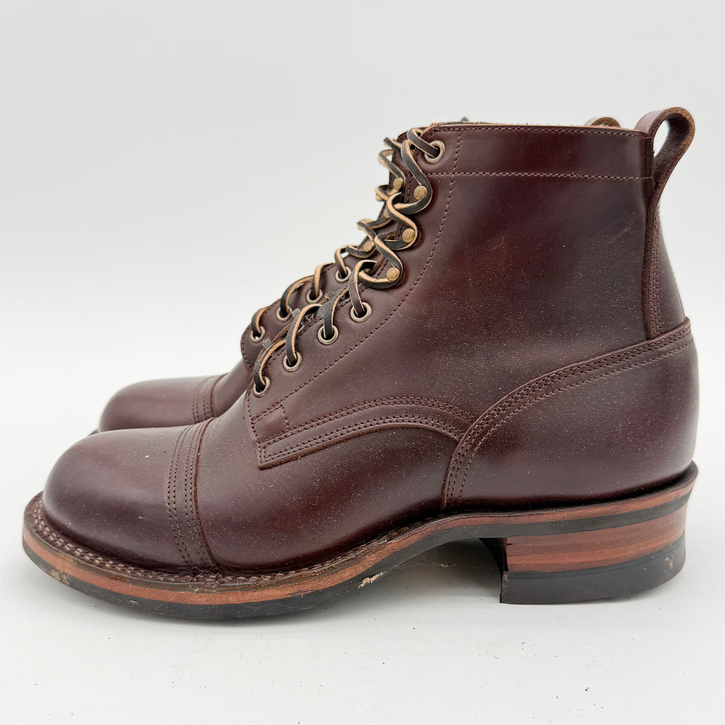 Brown leather boot with laces on a white background
