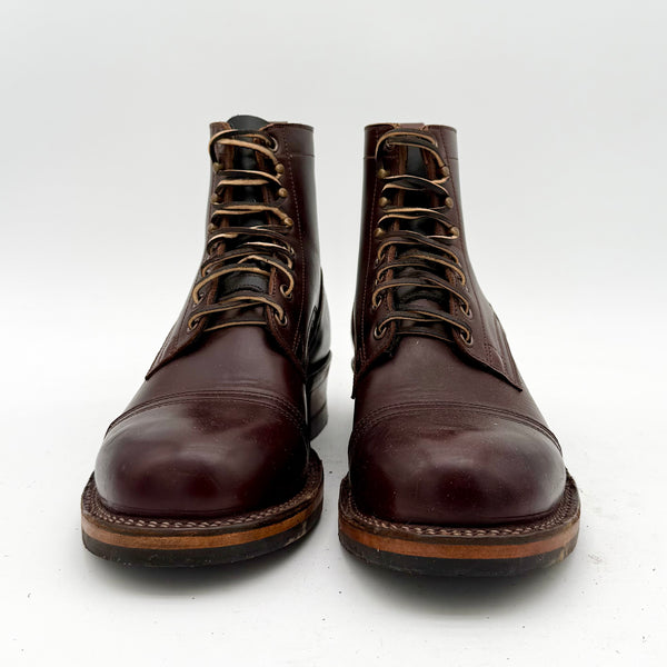 Pair of brown leather boots on a white background