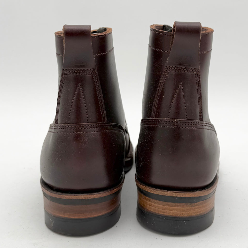 Pair of brown leather boots on a white background