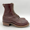 Brown leather boot with laces on a white background