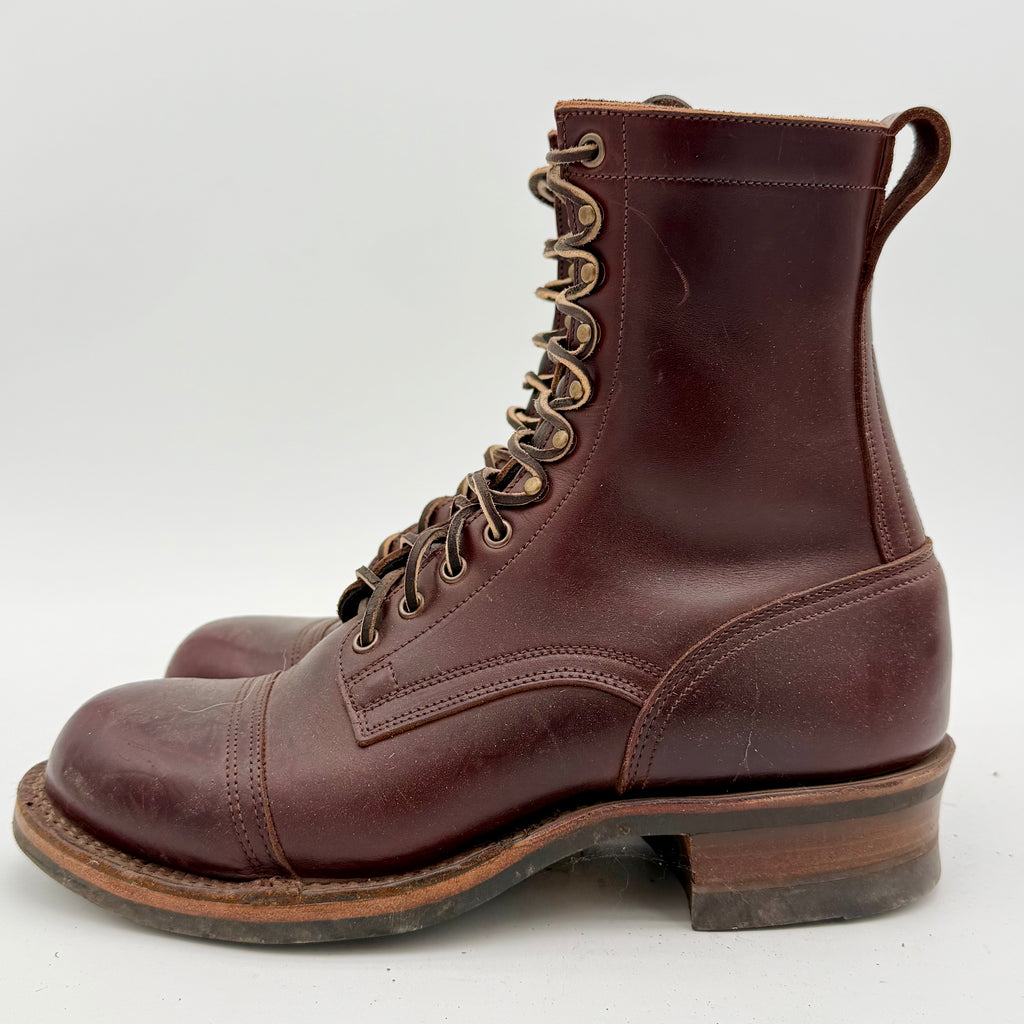 Brown leather boot with lace-up design on a white background