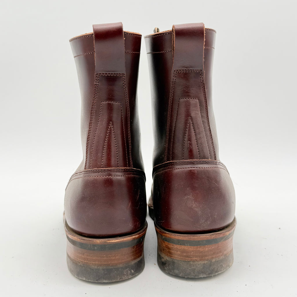 Pair of brown leather boots on a white background