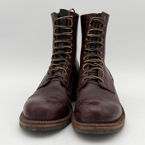 Pair of brown leather boots on a white background