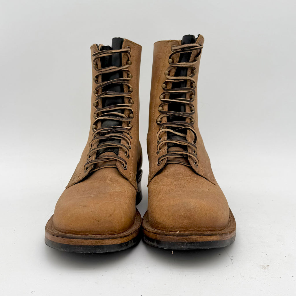 Pair of brown leather boots on a white background