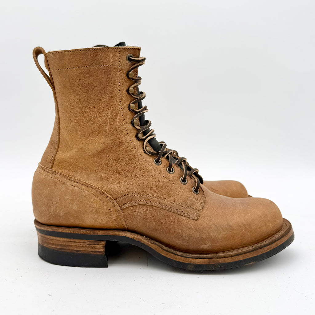 Pair of brown leather boots on a white background
