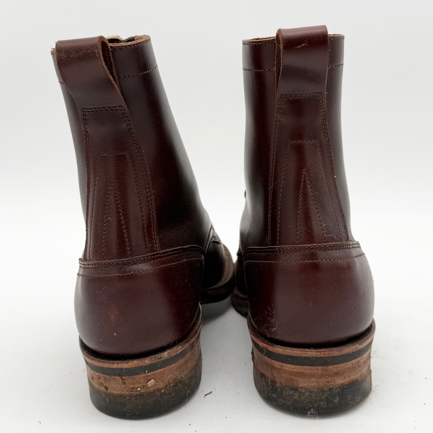 Pair of brown leather boots on a white background