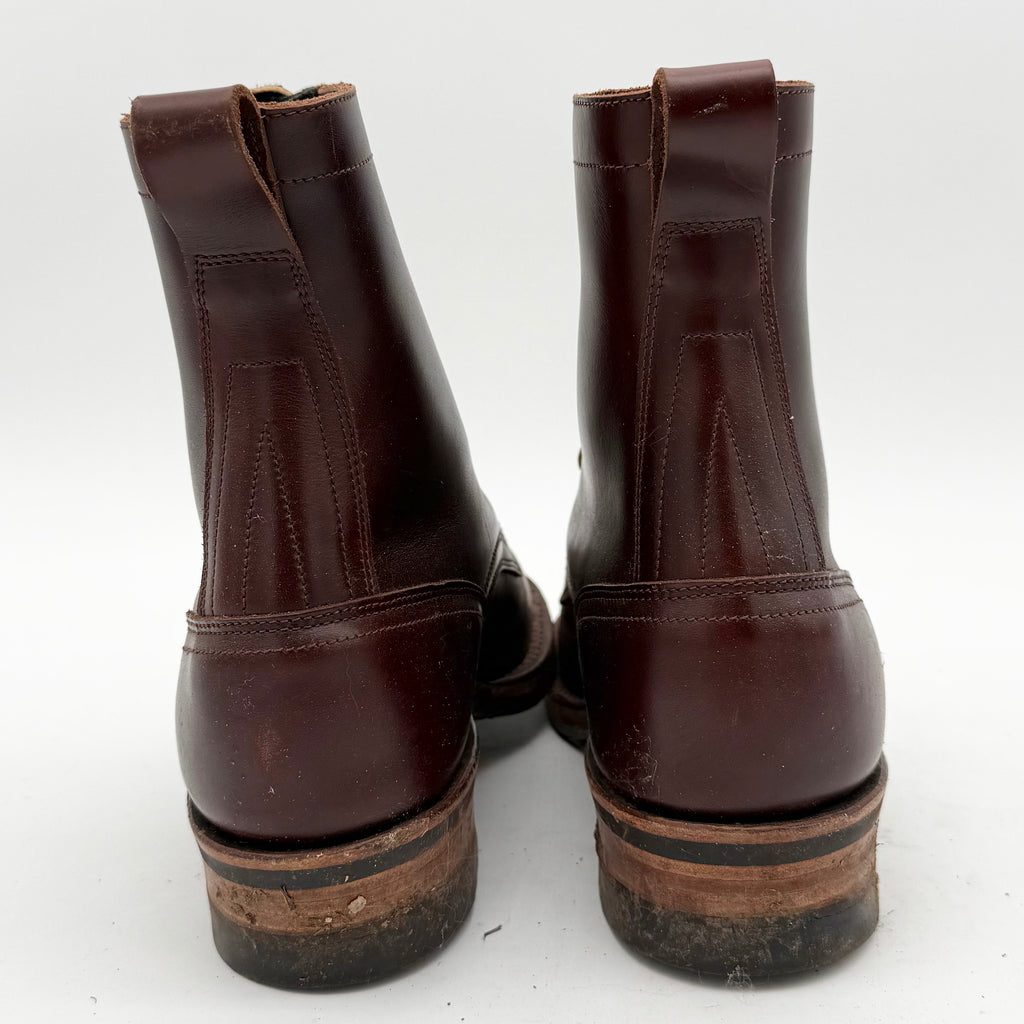 Pair of brown leather boots on a white background