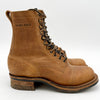Brown leather boot with laces on a white background