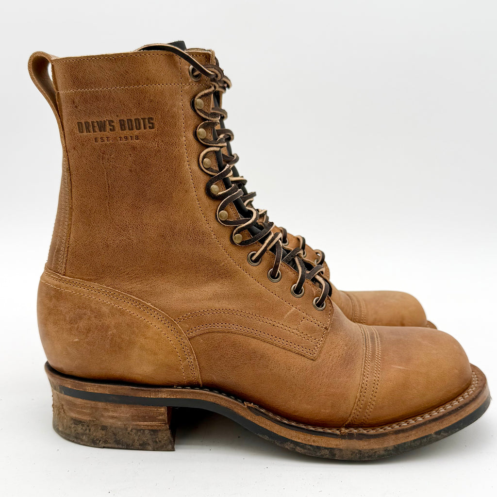 Brown leather boot with laces on a white background