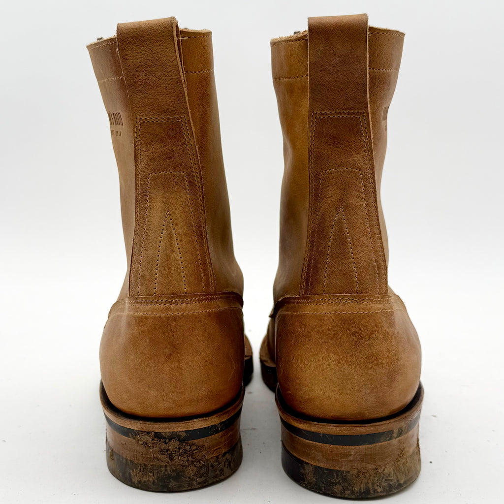 Pair of brown leather boots on a white background