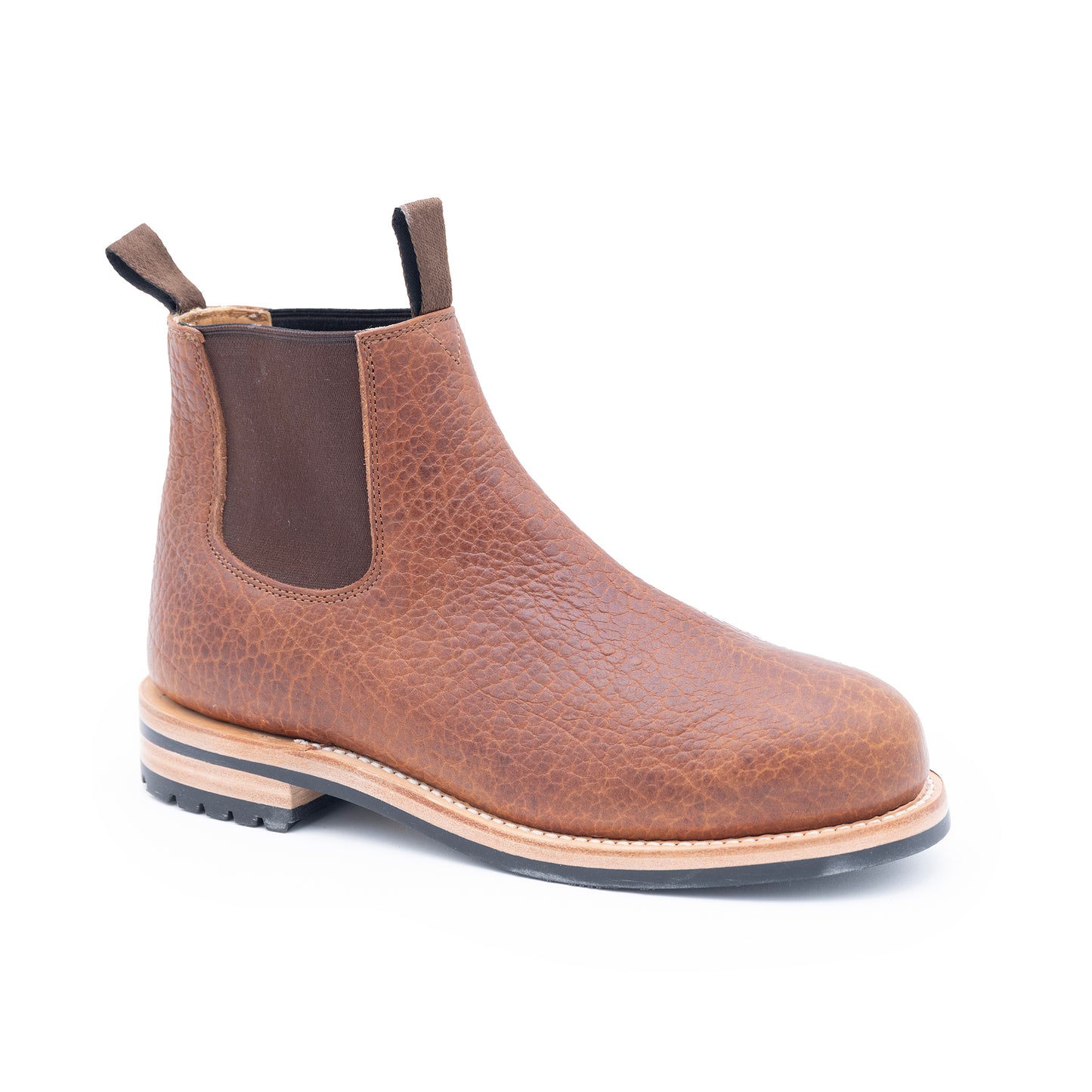 Brown leather Chelsea boot on a white background