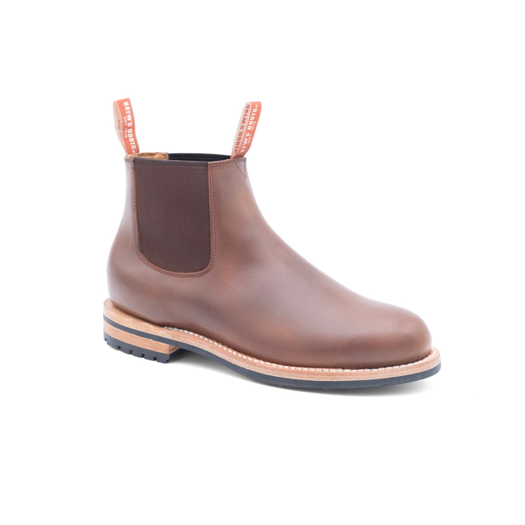 Brown leather slip on Chelsea boot with a white background