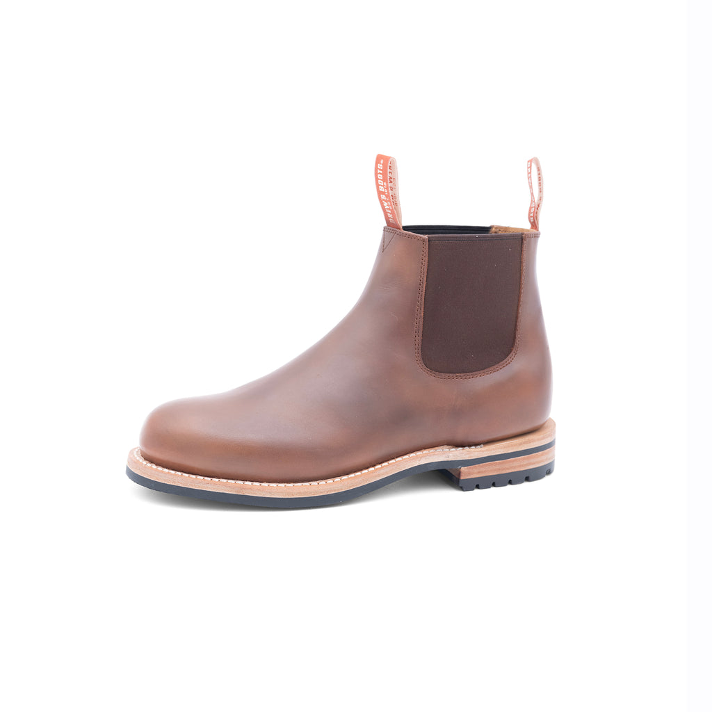 Brown Chelsea slip on leather boot on a white background