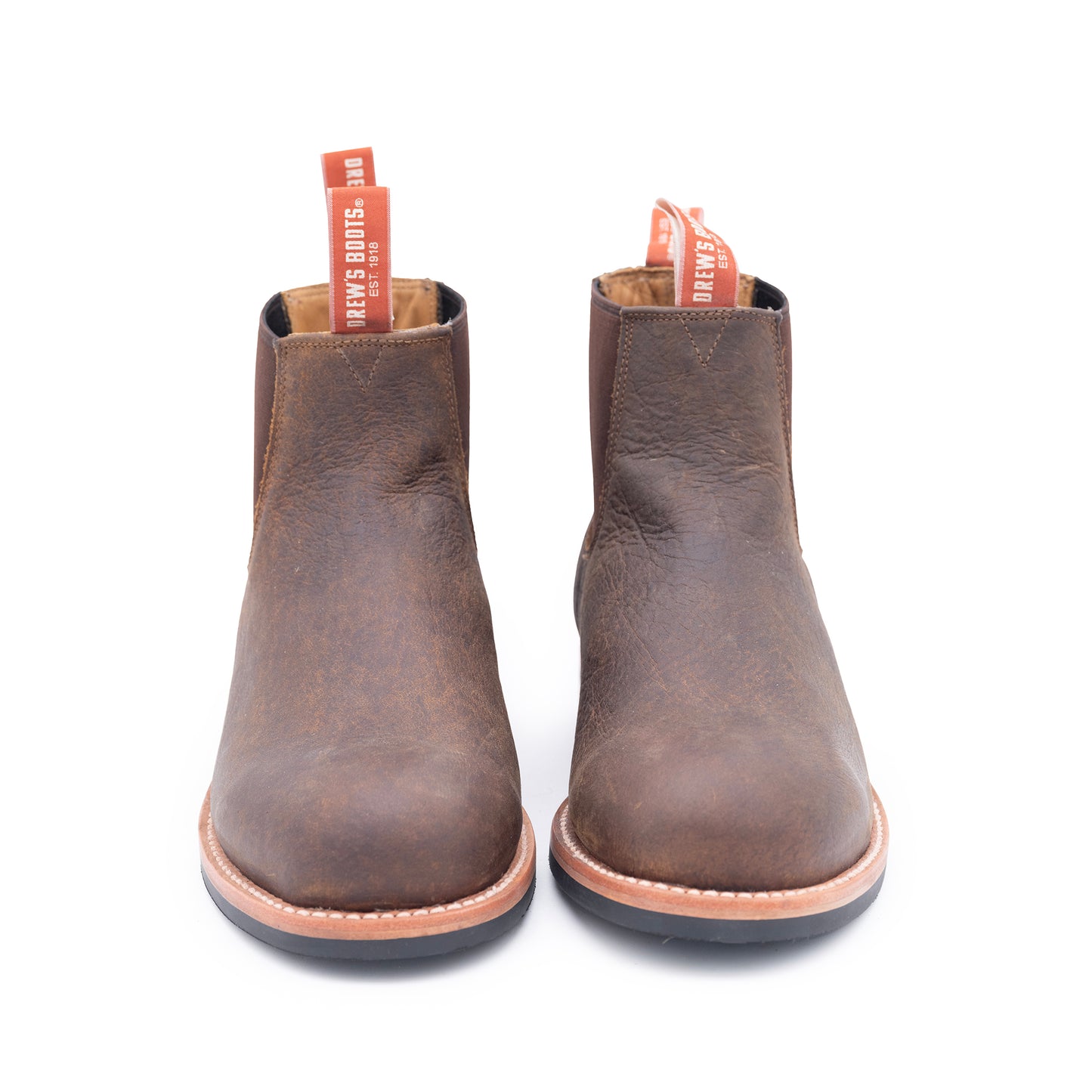 Pair of brown leather boots on a white background