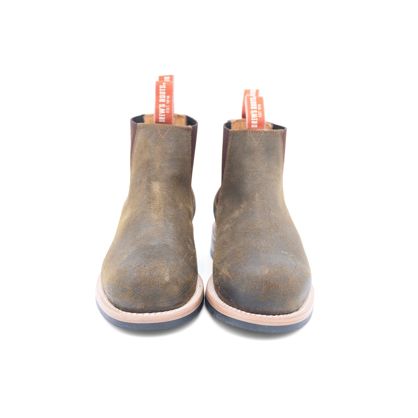 Pair of brown leather ankle boots on a white background