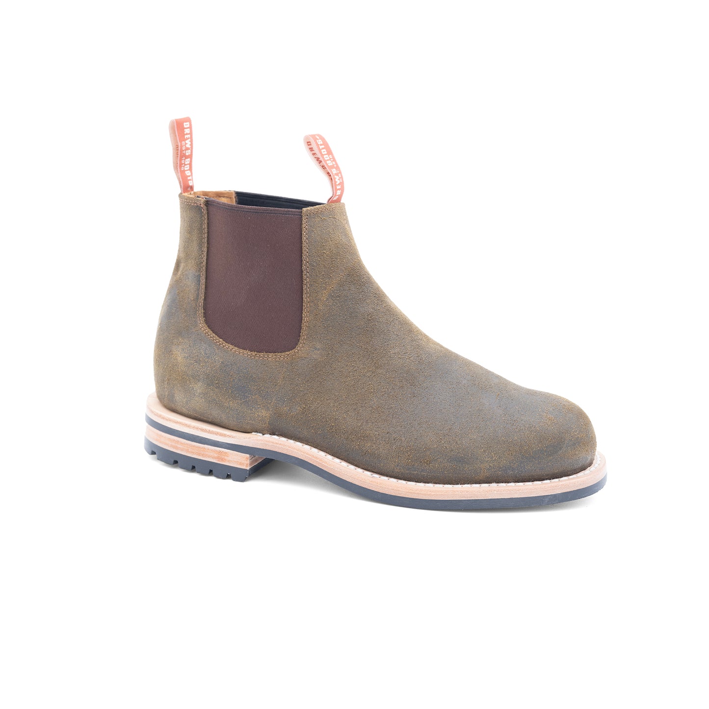 Olive Chelsea boot with brown patch on a white background