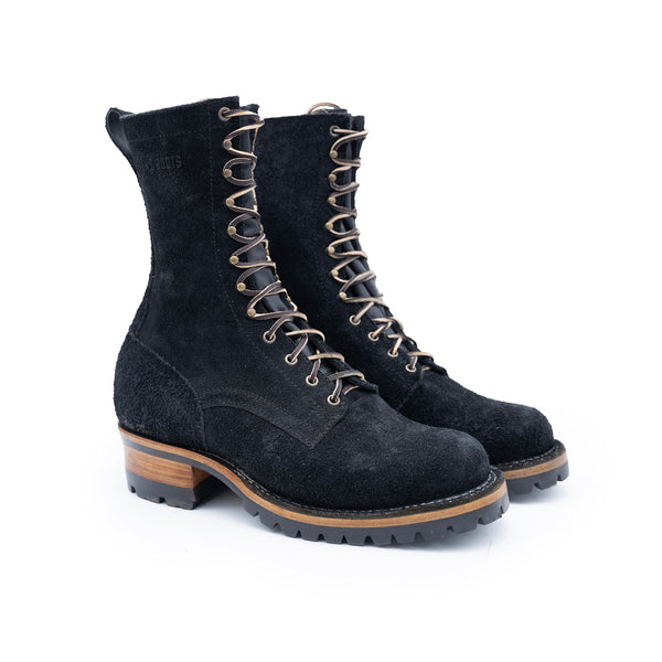 Pair of black suede boots with brown soles on a white background