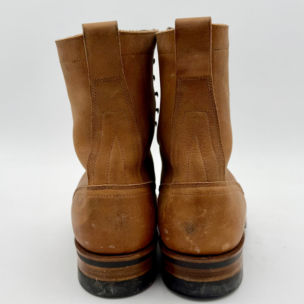 Pair of brown leather boots on a white background