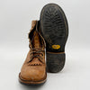 Brown leather boot with black Vibram sole on a white background